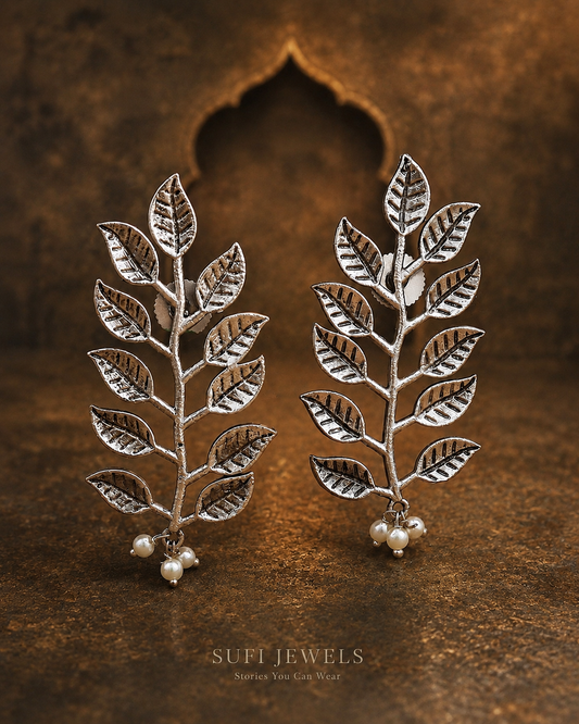 The Leaves Chose Tomorrow silver-look statement leaf stud earrings.