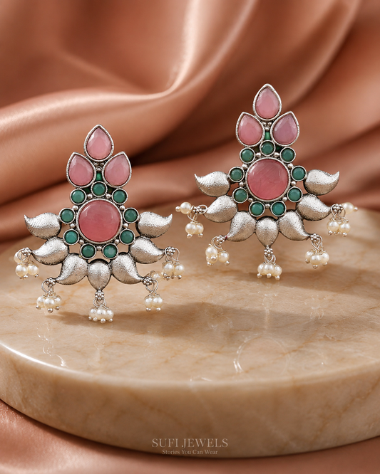 The Very First Bloom silver-look statement stud earrings with pink and turquoise stones and white pearl detailing.