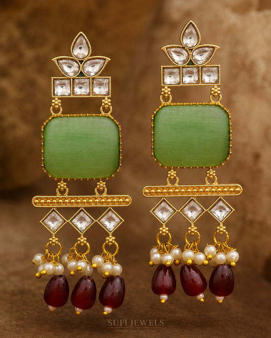 The Window Found Freedom gold-toned dangler earrings with a light green centre, red drops, luminous stones and pearl accents.
